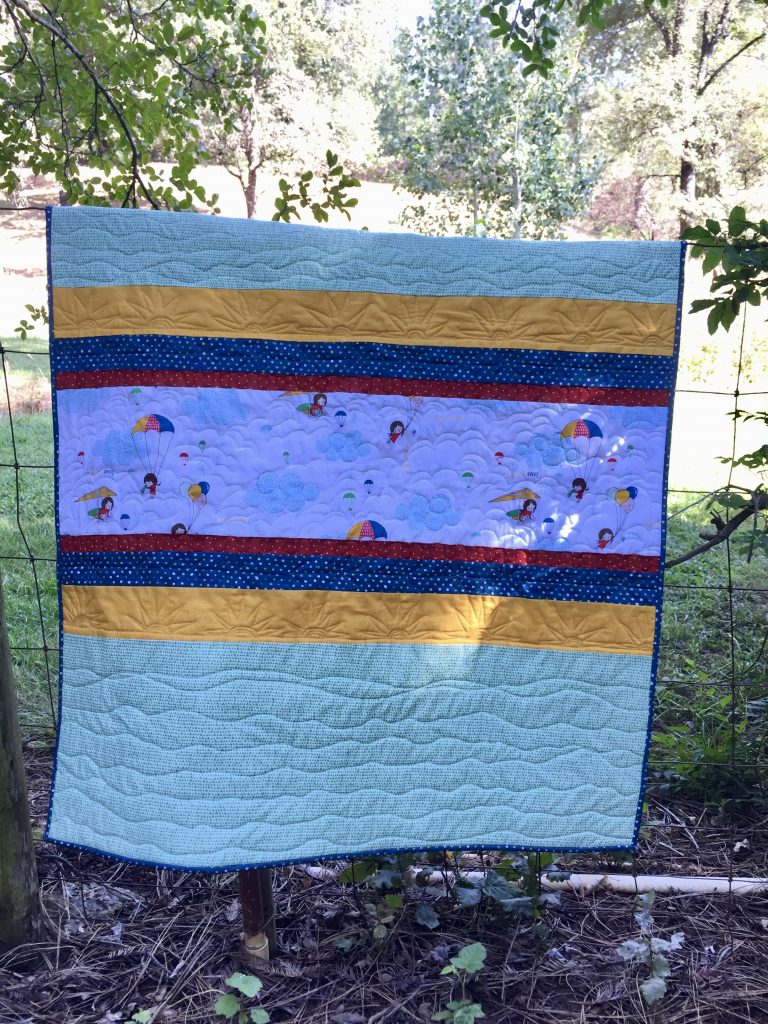 New Baby Quilt with a Cute Sisu Print | Needle and Foot